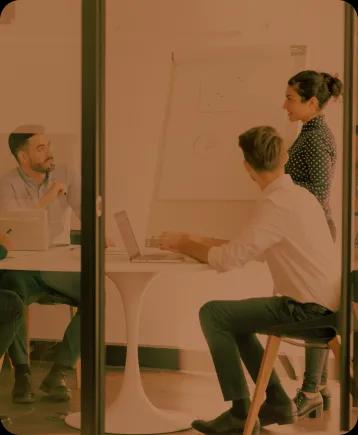 Professionals discussing work in an office setting